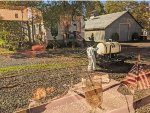 NVRR MoW worker with a small tank mounted on a cart